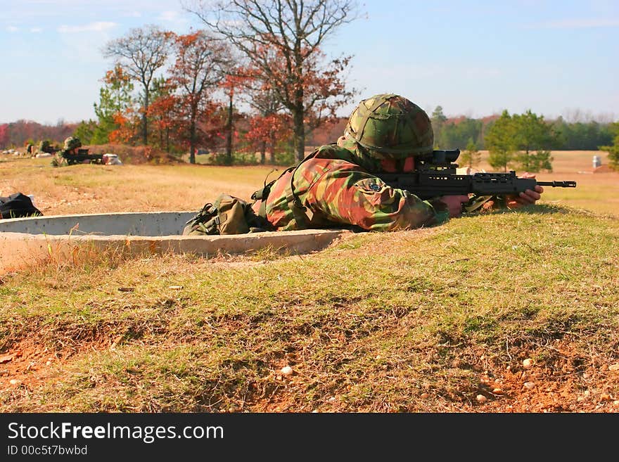 Soldiers firing SA80 rifles on the range