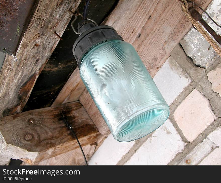 Street lamp hanging on the wall, rural scenic