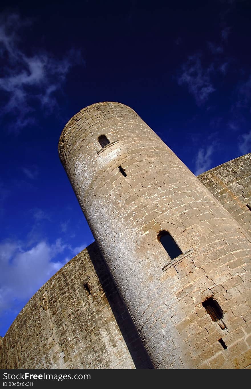 Tower of the castle of bellver in Palma de Mallorca with blue sky. Tower of the castle of bellver in Palma de Mallorca with blue sky