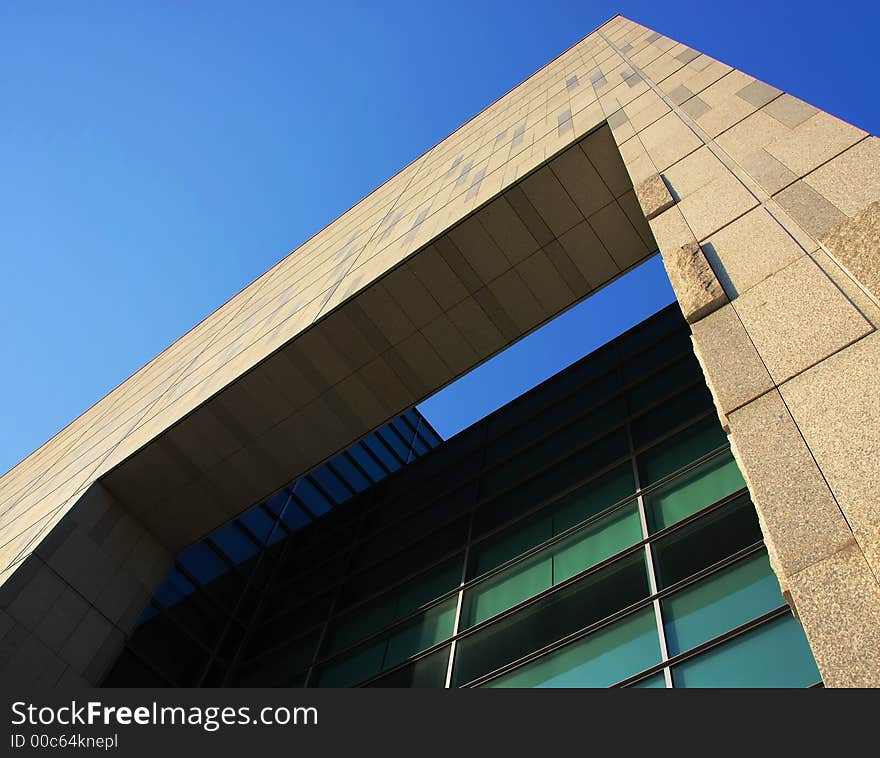 A picture of authority; the lines of a modern building framed against a pure blue sky. A picture of authority; the lines of a modern building framed against a pure blue sky.