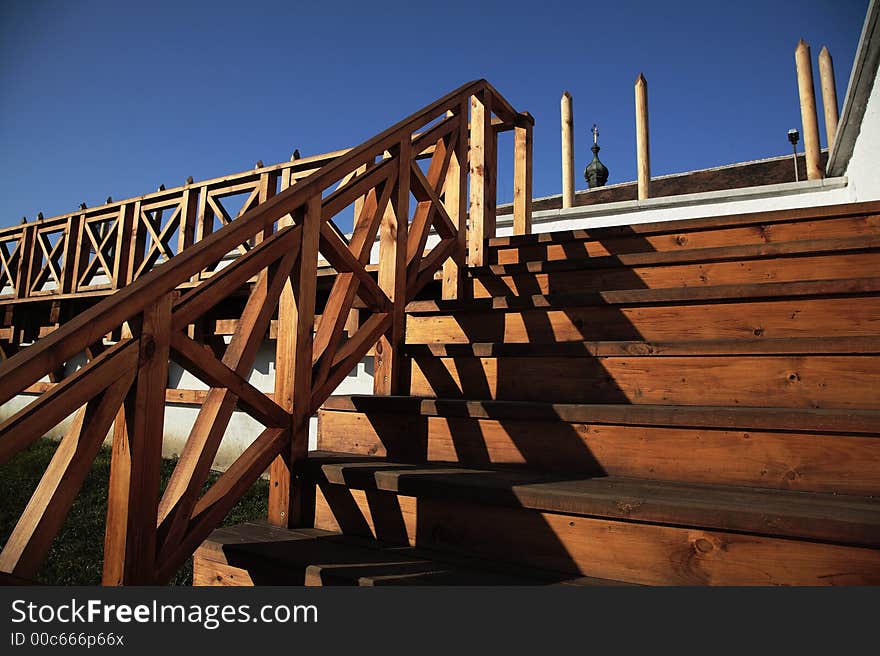 Outdoor wooden stairs with banister