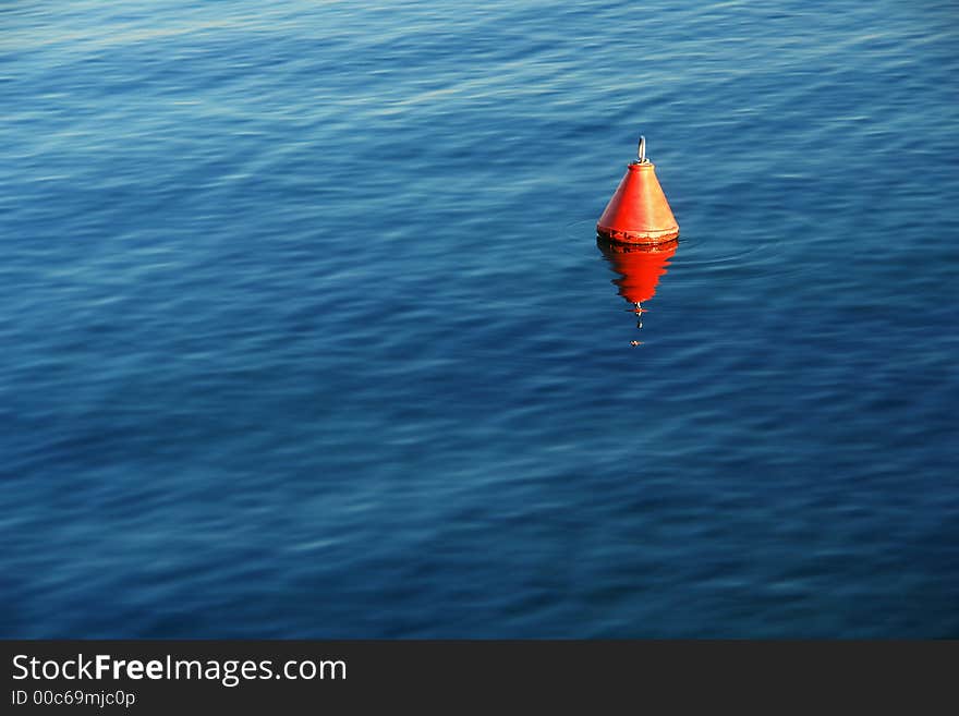 A red float on a lake