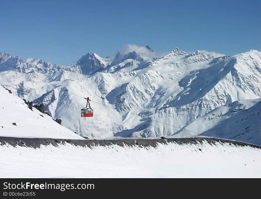 Cable car in mountains of caucasus. winter vacations.