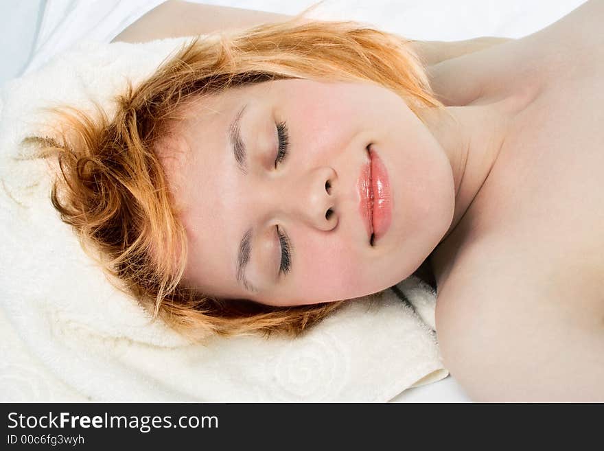 Close-ups portrait relaxead redheaded on towel