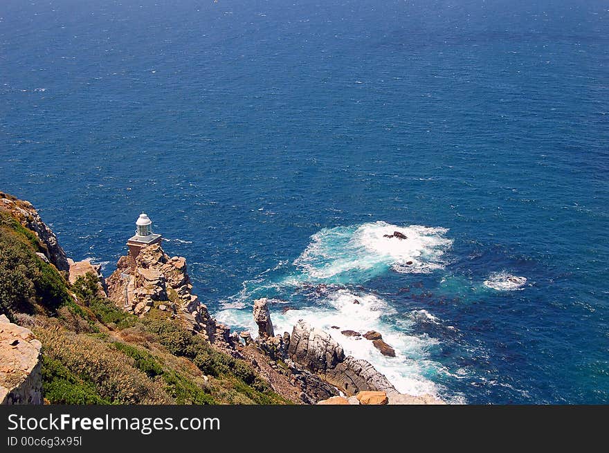 Ocean- shore-rocks-lighthouse-stone blocks-reefs-surf. Ocean- shore-rocks-lighthouse-stone blocks-reefs-surf