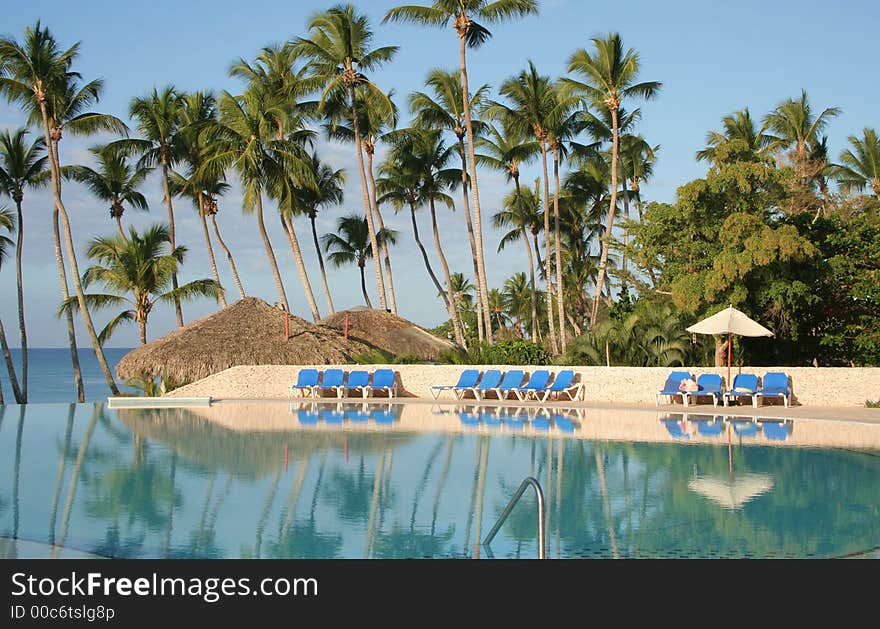 Chairs near a pool in the tropics. Chairs near a pool in the tropics