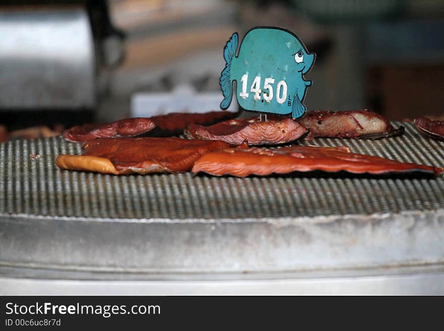 Grilled salmon for sale at an outdoor restaurant