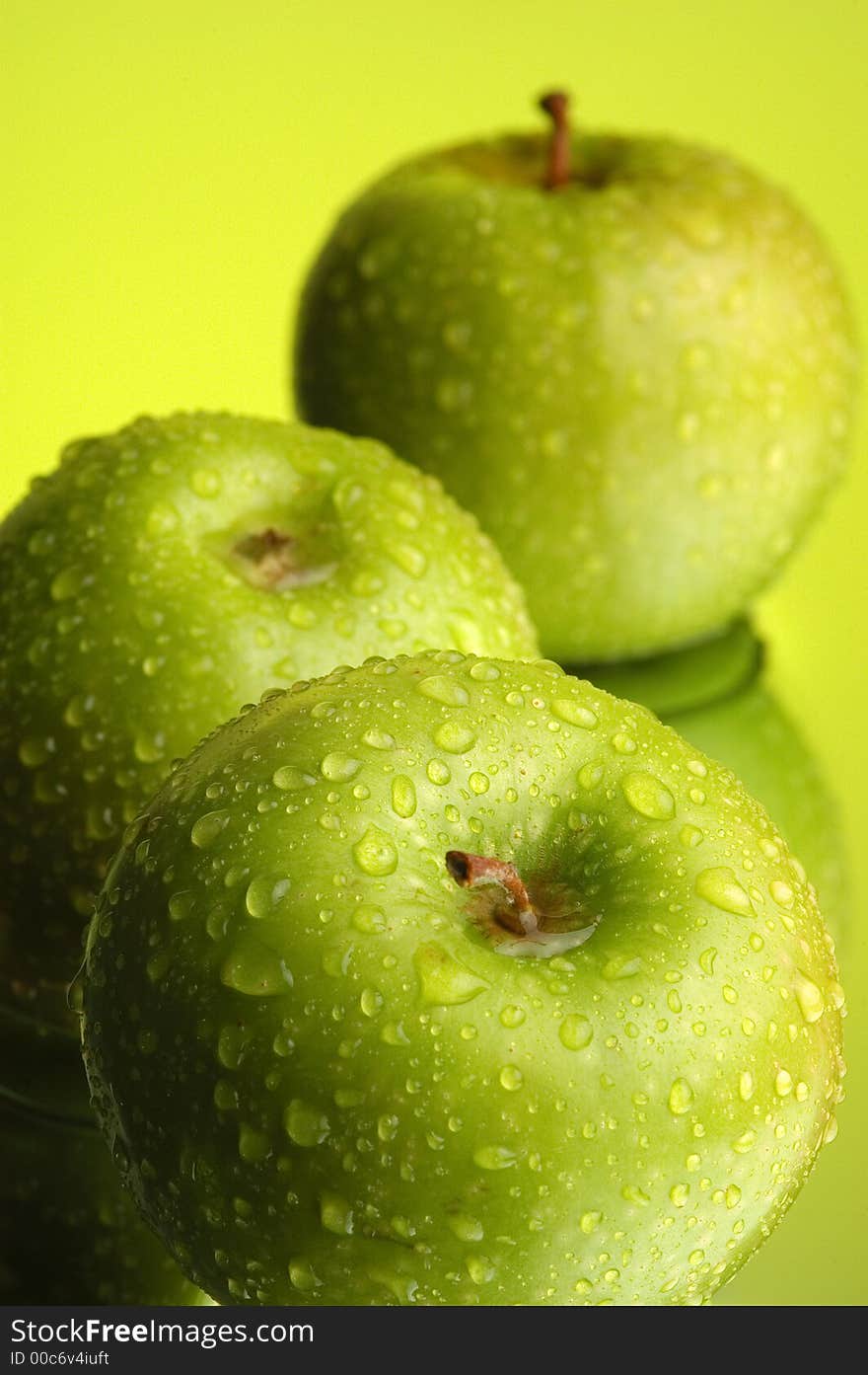 Green apple, water and mirror surface. Green apple, water and mirror surface