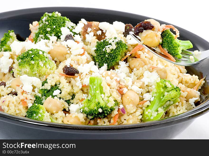 Combine couscous, broccoli, shredded carrots, raisins, nuts, garbanzo beans, and seasonings top with feta cheese and serve hot or cold. Combine couscous, broccoli, shredded carrots, raisins, nuts, garbanzo beans, and seasonings top with feta cheese and serve hot or cold.