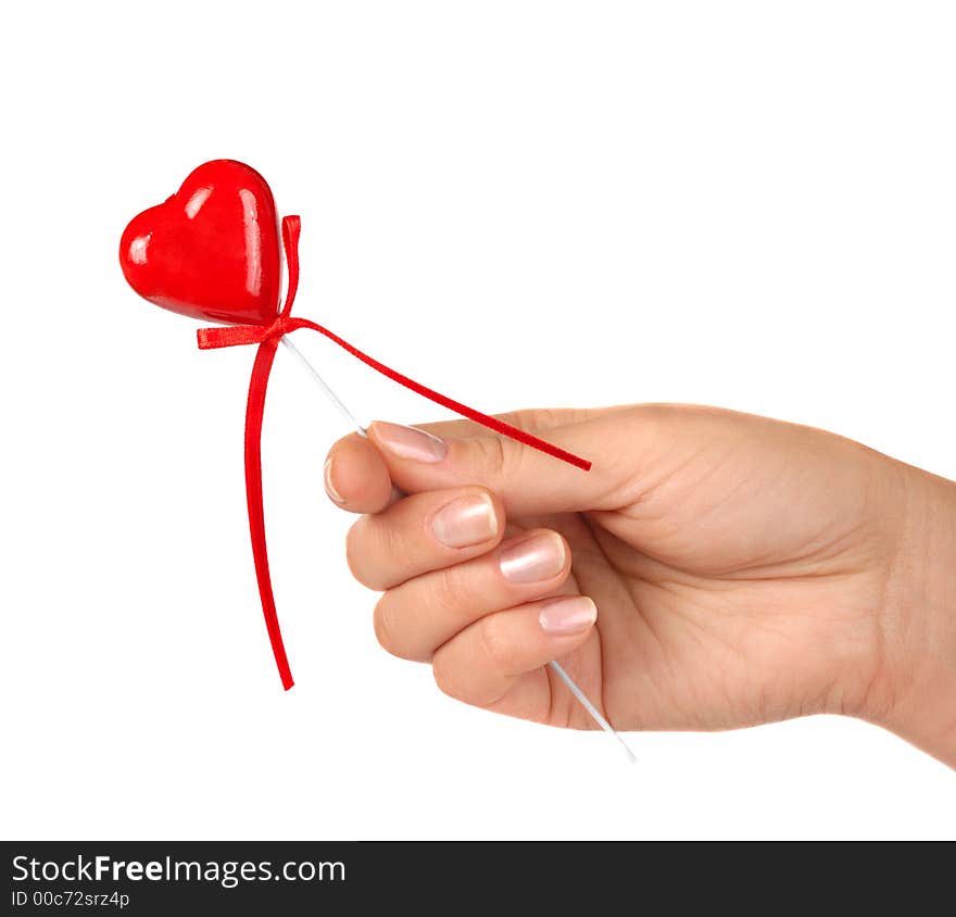 Female hand holding little red heart Valentine Day concept Isolated on white background. Female hand holding little red heart Valentine Day concept Isolated on white background