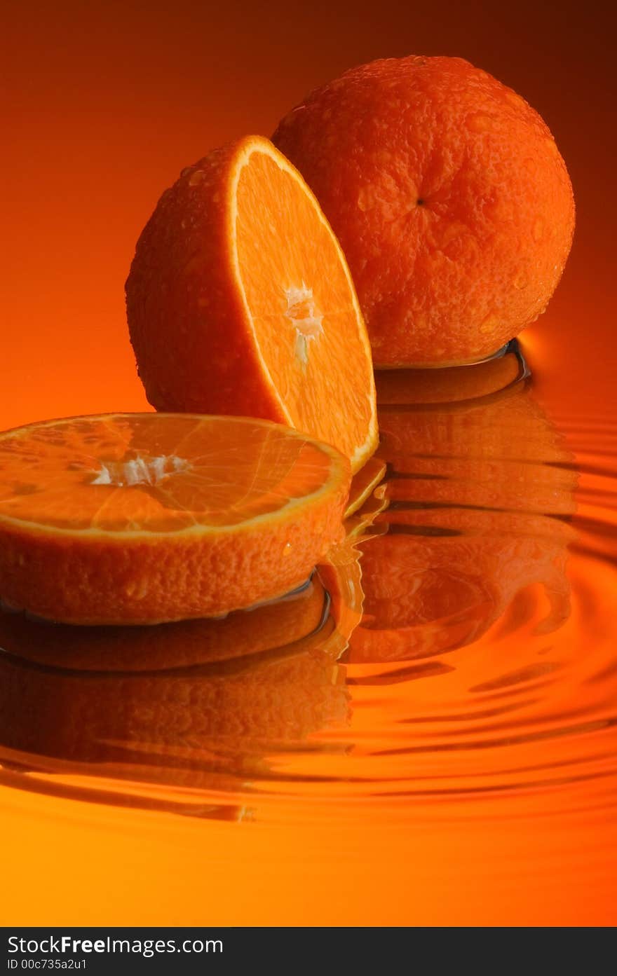 Orange, water and mirror surface. Orange, water and mirror surface