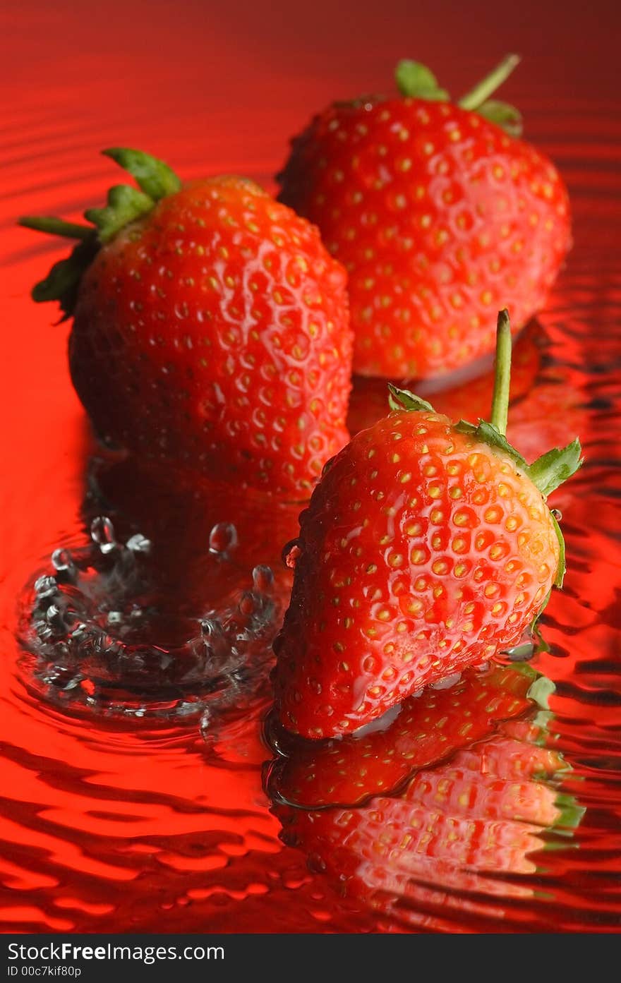 Strawberry, water and mirror surface. Strawberry, water and mirror surface