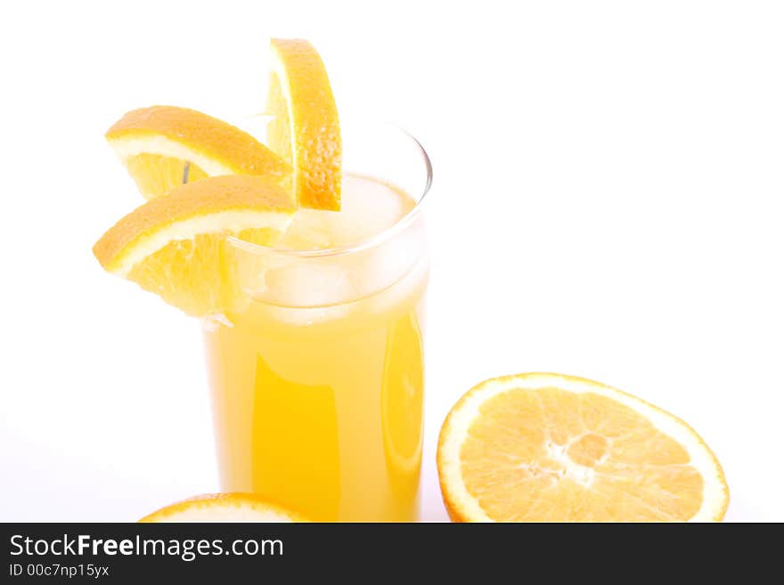 Orange juice and half-cut oranges isolated on white