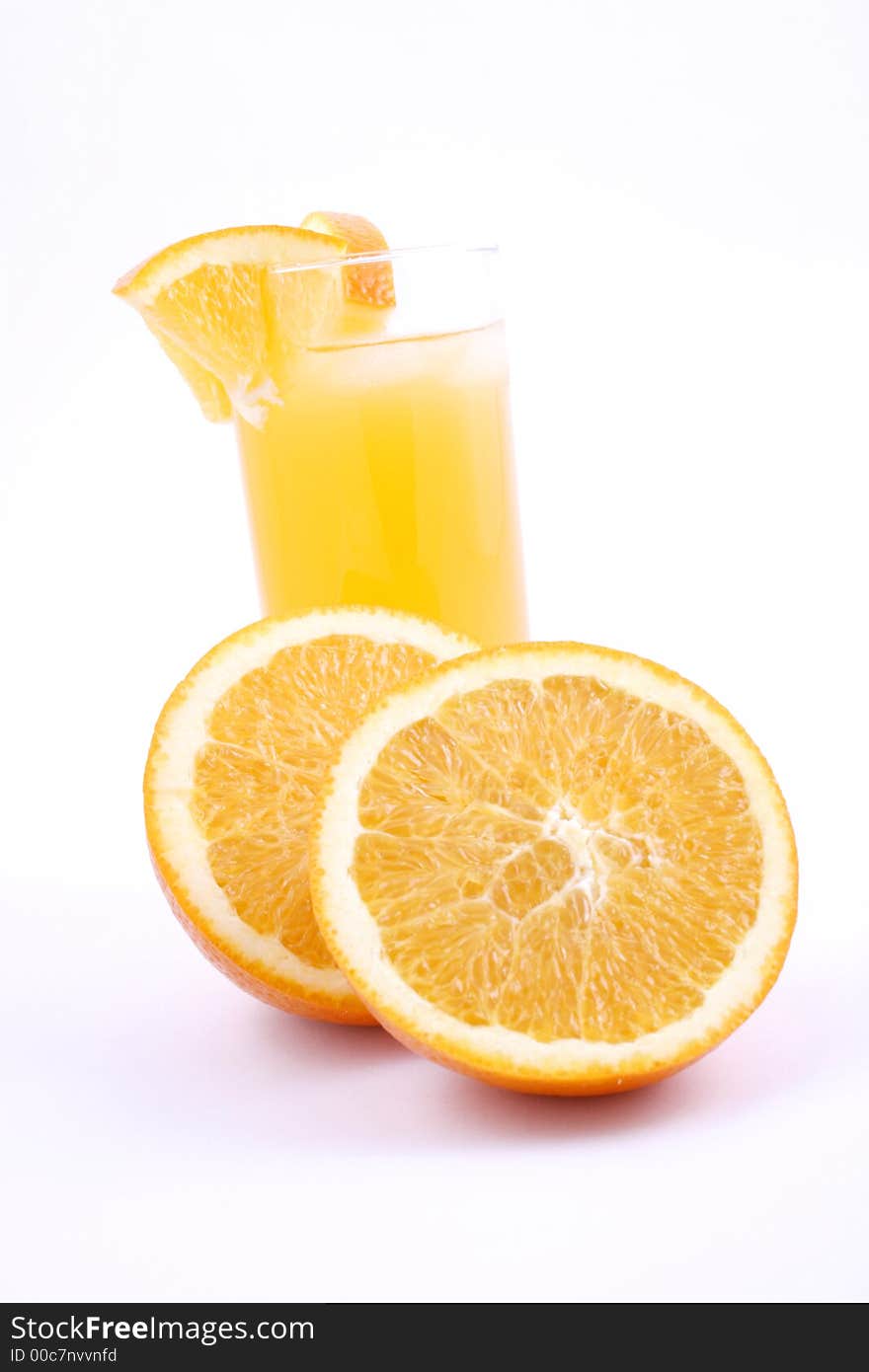 Orange juice and half-cut oranges isolated on white