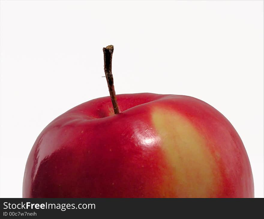 The apple photographed close up, red