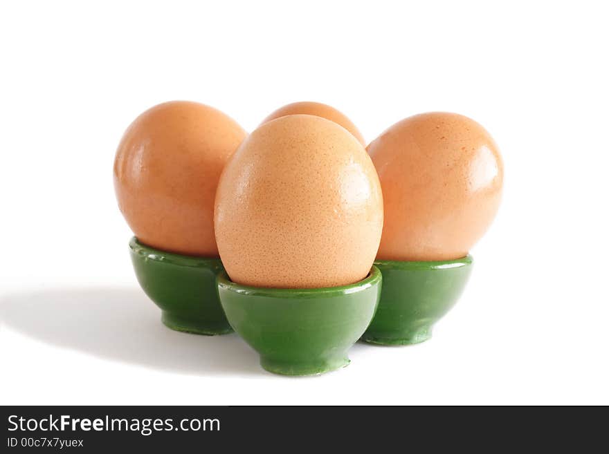 Four eggs in their egg-cup. Four eggs in their egg-cup