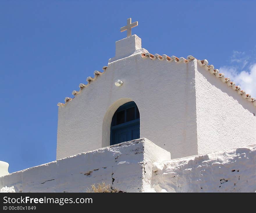 A simple white painted church in Greece. A simple white painted church in Greece.