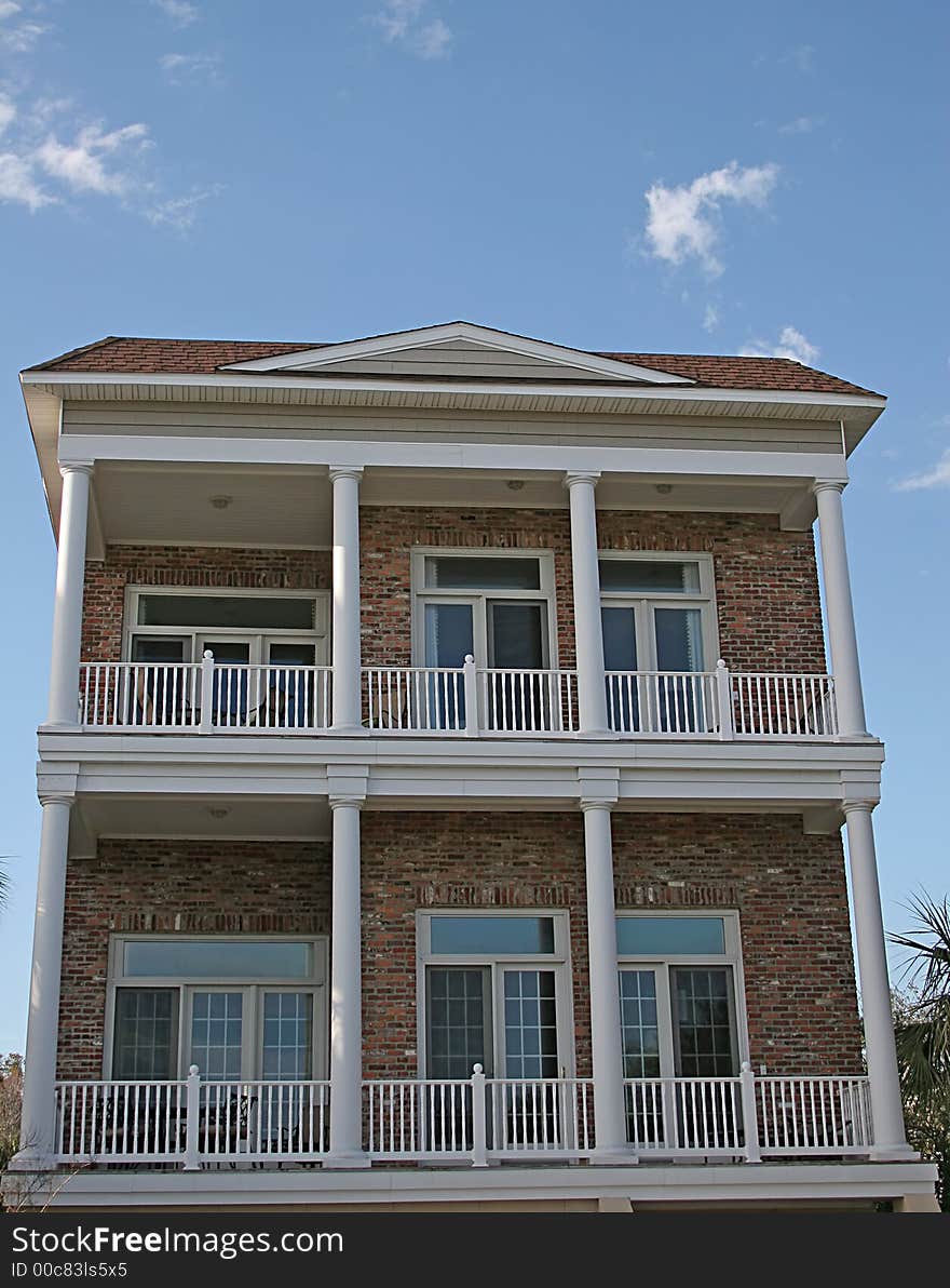 Two story brick house on a coastal road. Two story brick house on a coastal road