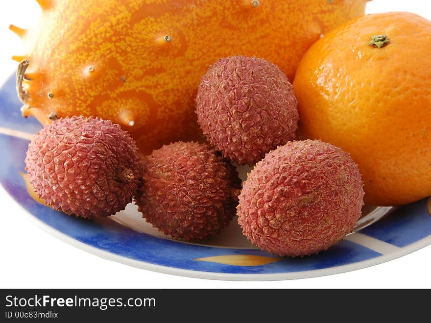 Fresh tropical fruit on a plate. Fresh tropical fruit on a plate