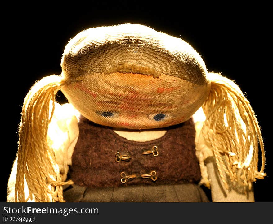 Old sad cloth doll with spot light 3