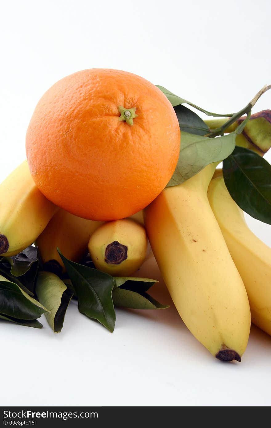 Fresh bananas and orange on white background (fruits, food, vitamin)