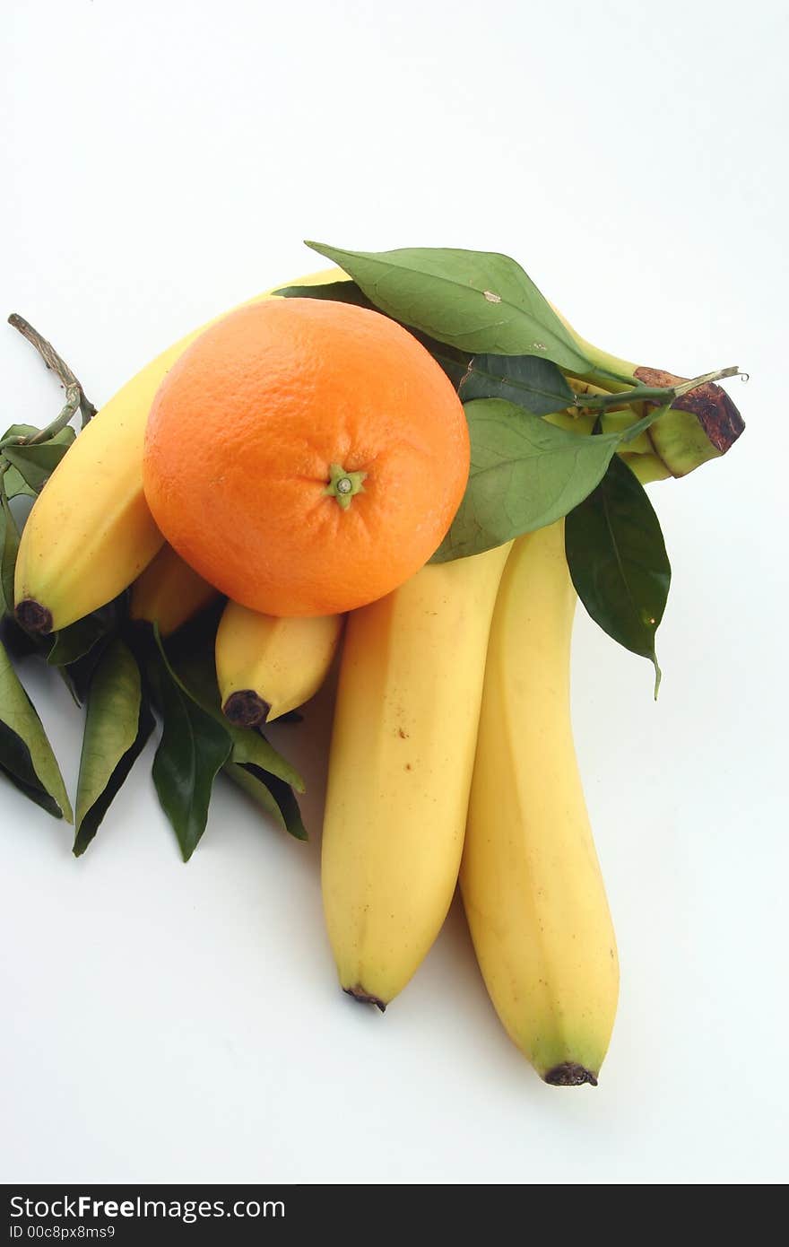 Fresh bananas and orange on white background (fruits, food, vitamin)