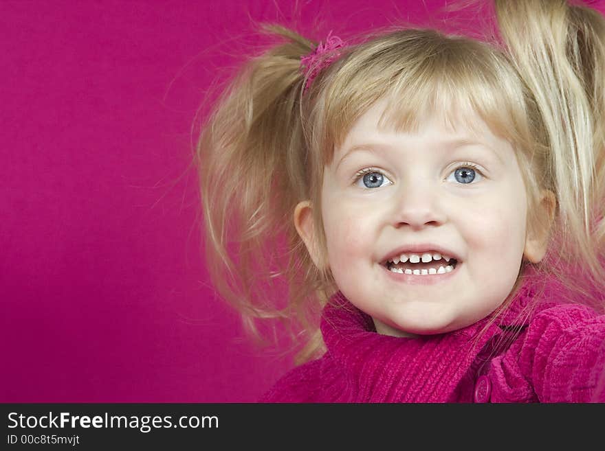 Cute Girl In Pink Laughing