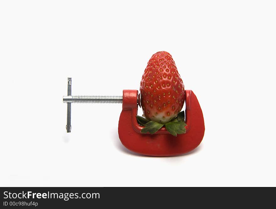 Strawberry clamped in vice