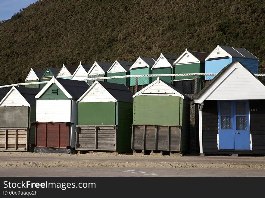 Wooden beach huts in the spring along west cliff bournemouth dorset england uk