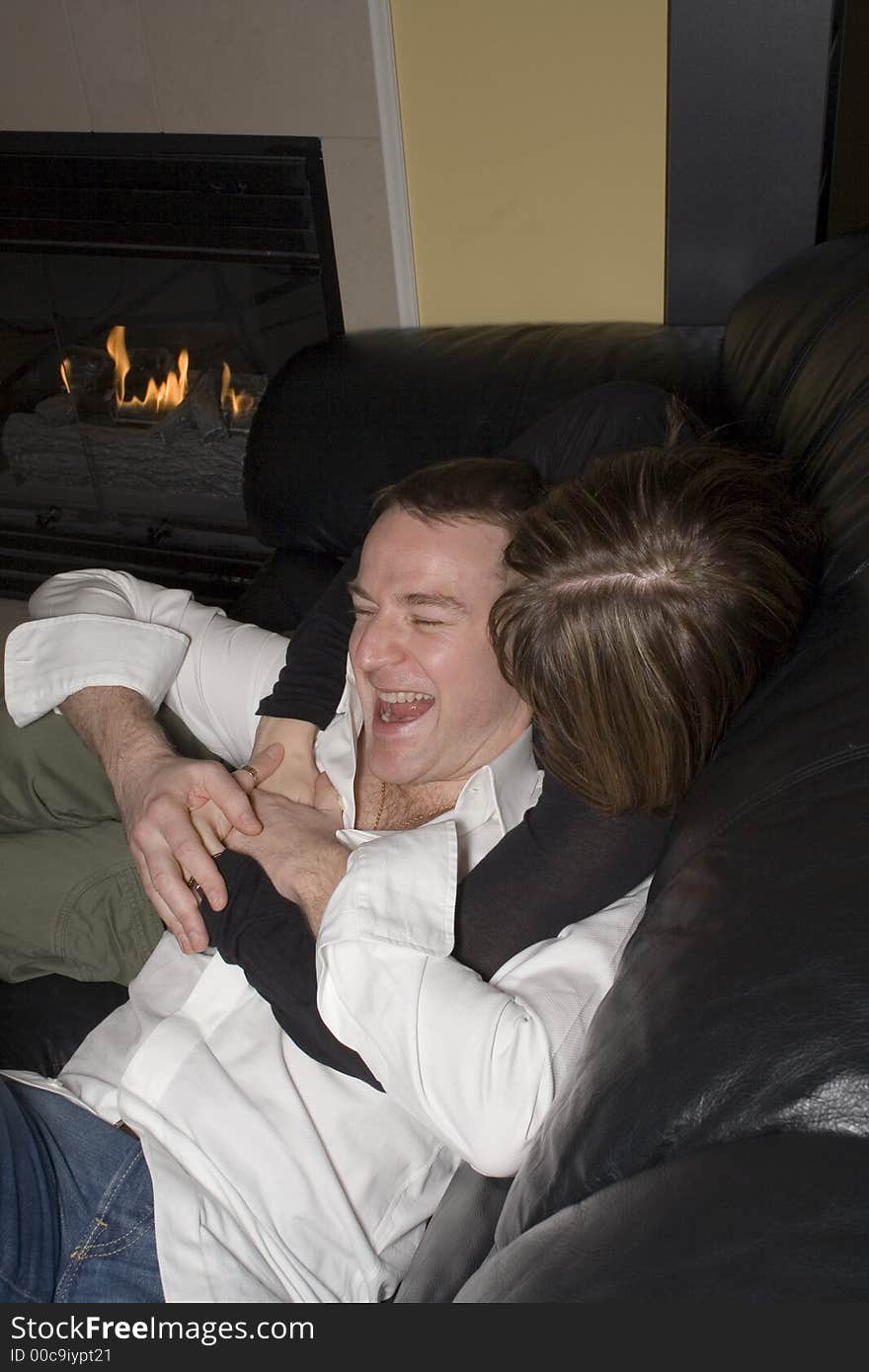 Happy couple relaxing on couch