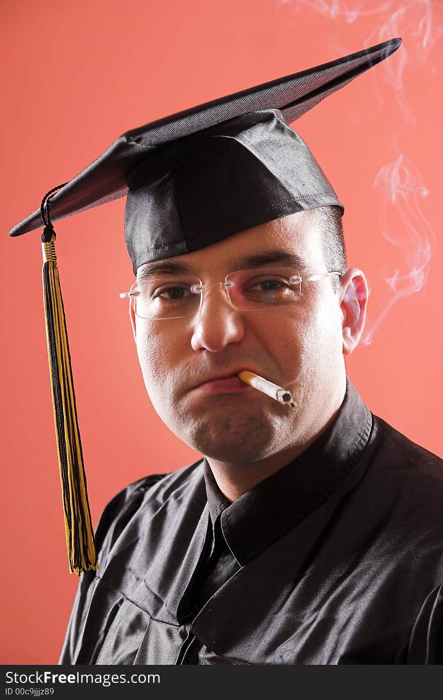 Smoking graduation a young man