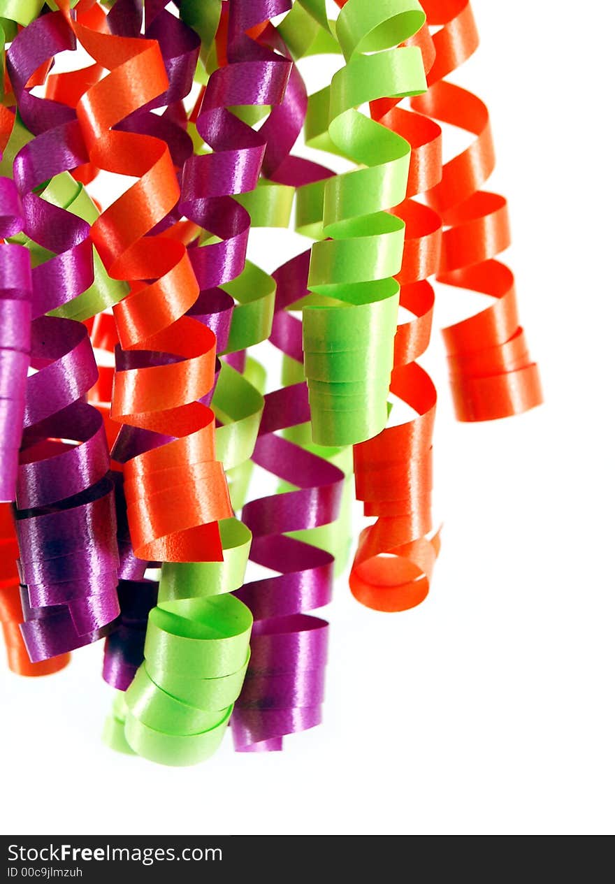 Bright colorful curly ribbons against a white background. Bright colorful curly ribbons against a white background