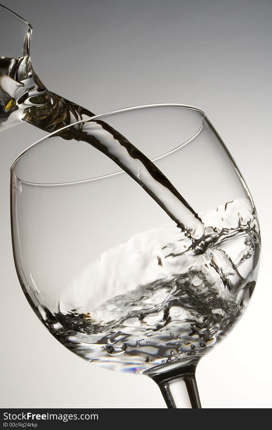 Water Pouring Into A Glass