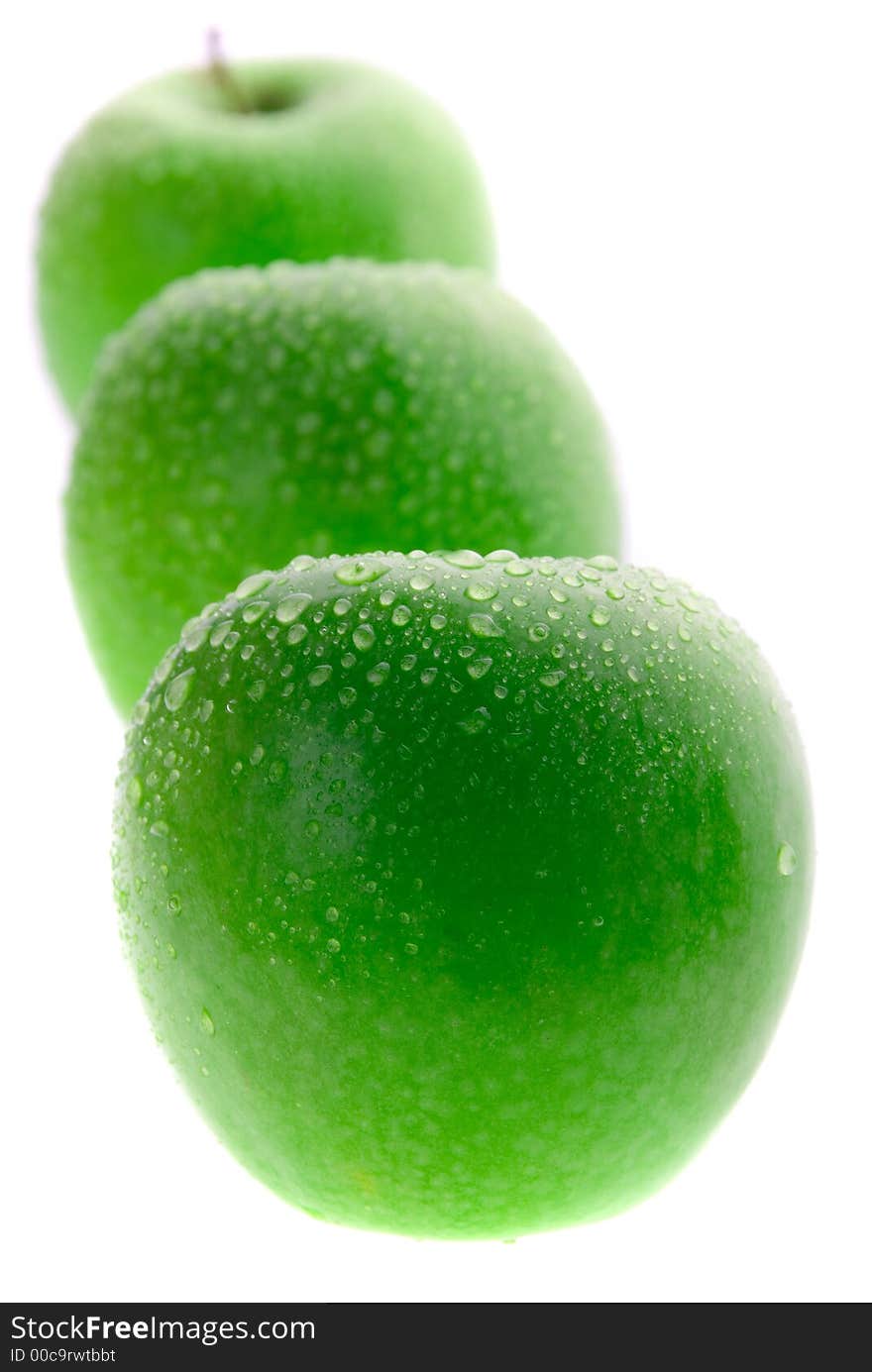 Wet green apple isolated on white background