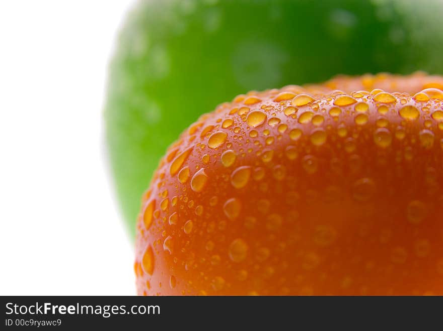 Fresh wet red tomato and green apple. Macro. Fresh wet red tomato and green apple. Macro.