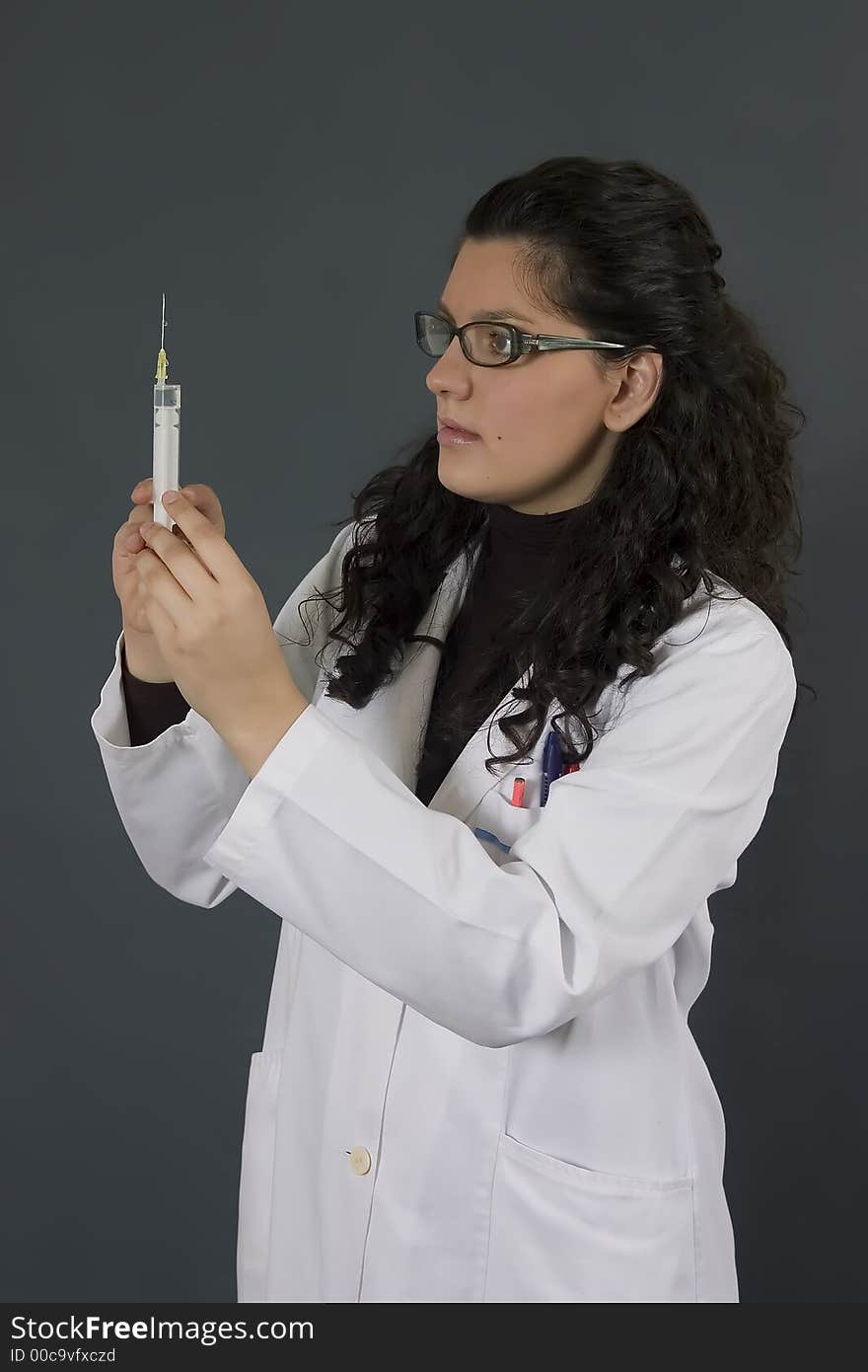 Young female doctor with injection