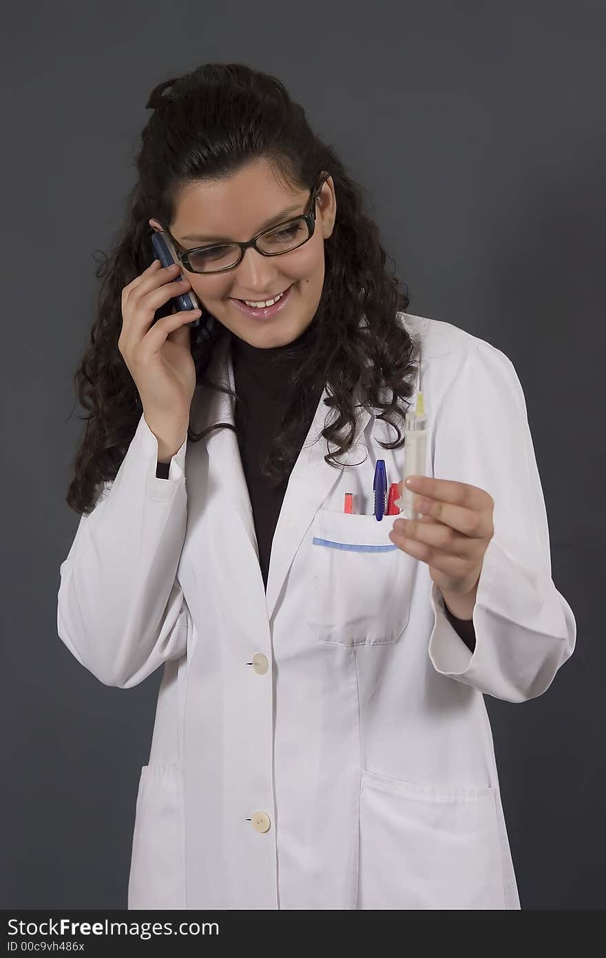 Young female doctor with injection