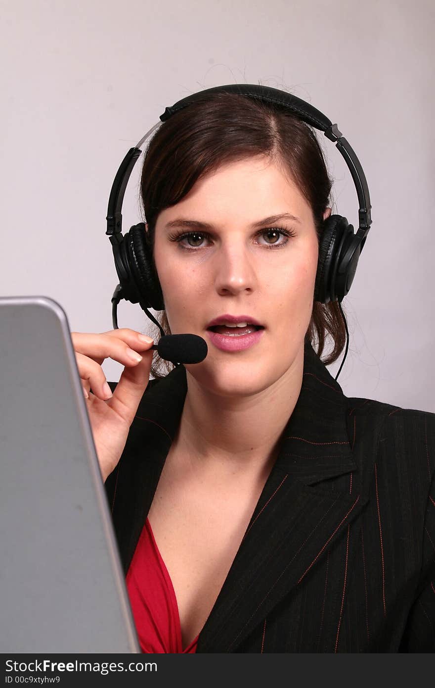 A young businesswoman in front of her laptop. A young businesswoman in front of her laptop.