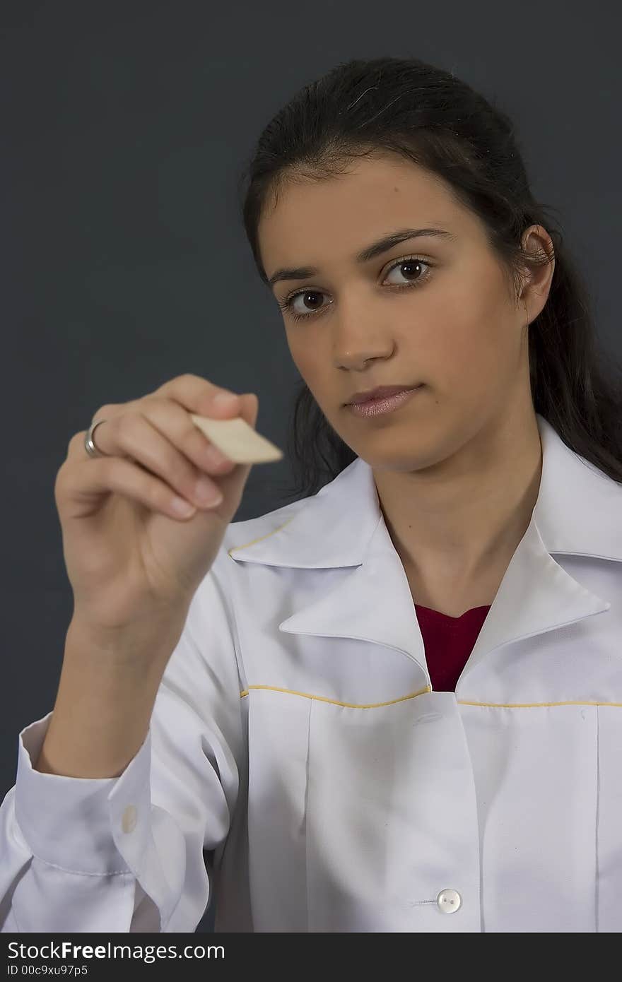 Young female doctor in white lab coat. Young female doctor in white lab coat