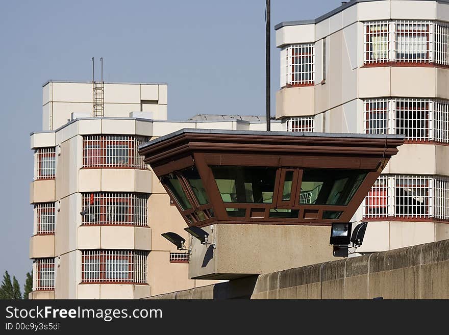 Watch tower on wall, jail in Background. Germanys biggest penal institution JVA Tegel in the city Berlin. Watch tower on wall, jail in Background. Germanys biggest penal institution JVA Tegel in the city Berlin.