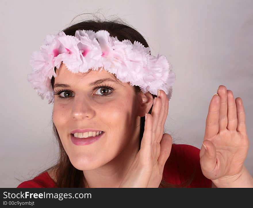 A young sexy woman with flowers in her hair. A young sexy woman with flowers in her hair.