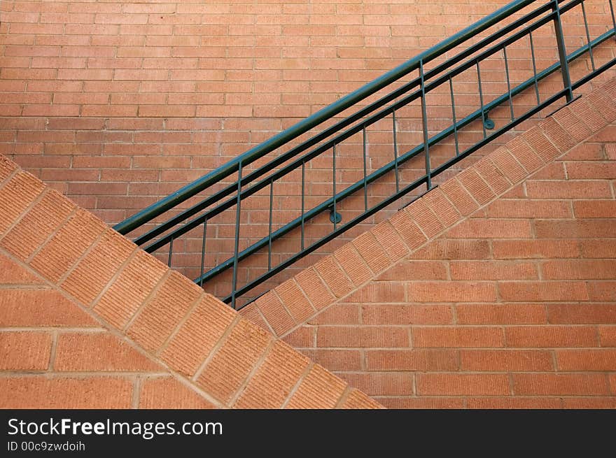 Brick staircase with iron railing.