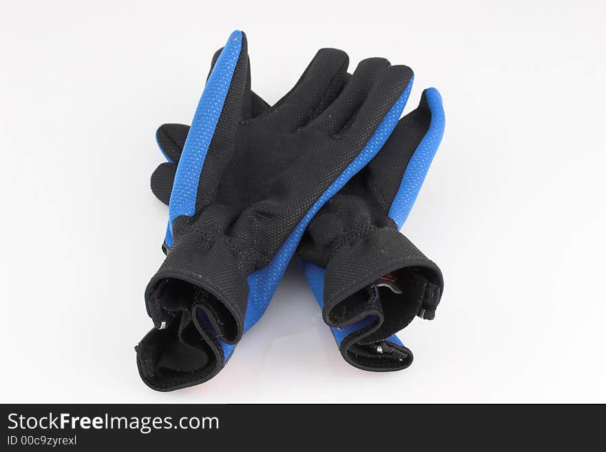 Pair of old sport gloves on white background