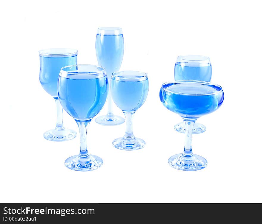 Glasses with a blue liquid on a white background