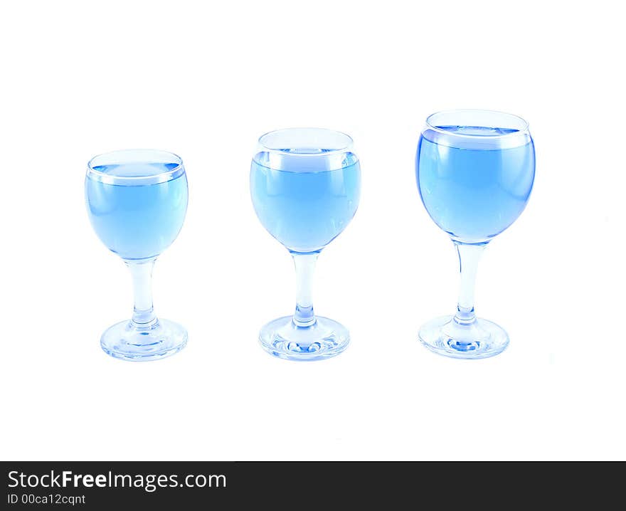 Glasses with a blue liquid on a white background