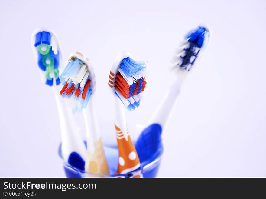 Toothbrushes on a glass