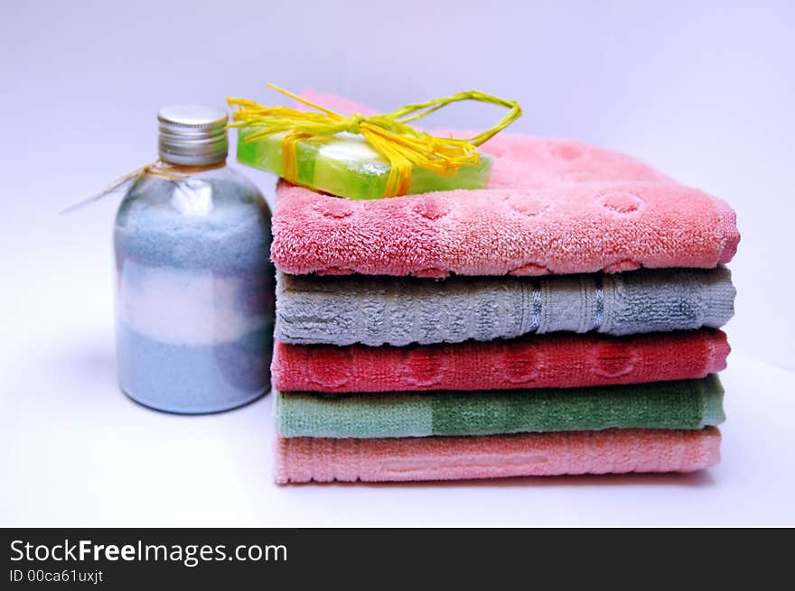 Bath towels of different colours piled on top of one another. Bath towels of different colours piled on top of one another