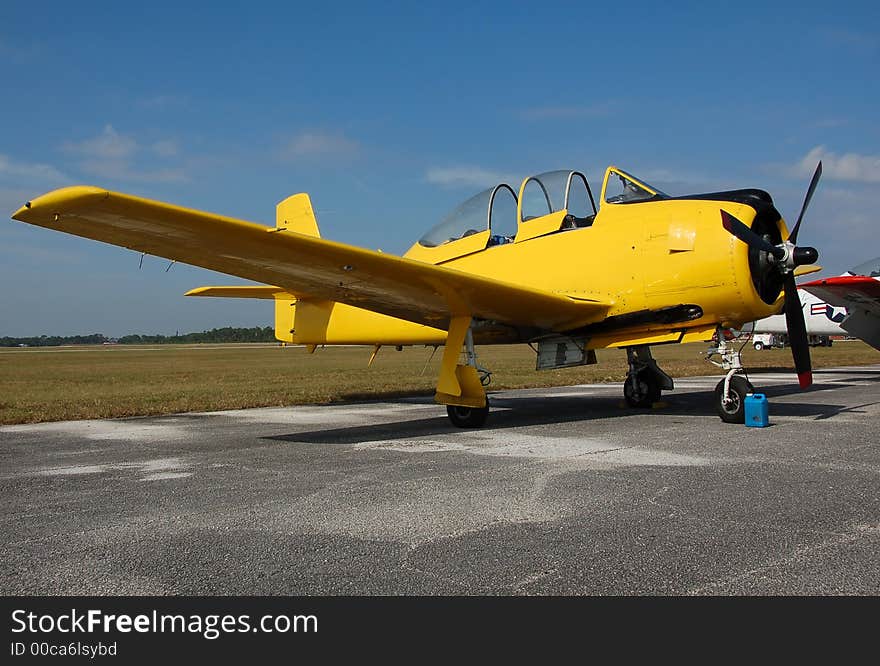 Vintage T-28 trainer airplane in yellow color