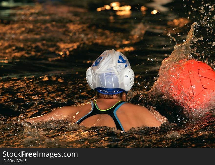 The floating child in water with sparks and red ball. The floating child in water with sparks and red ball