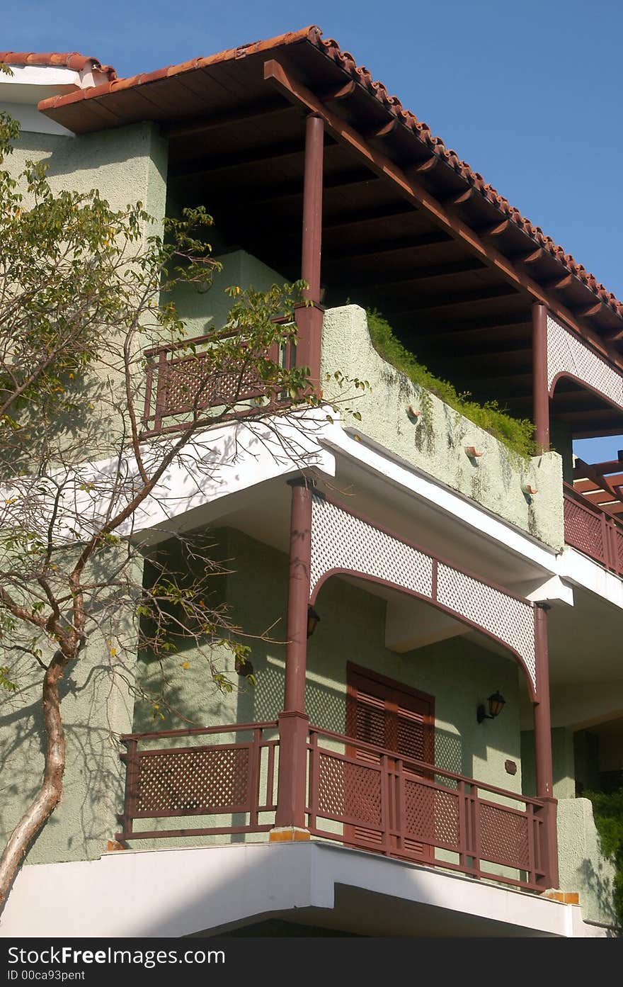 Sunny Colonial balcony in a beautiful resort